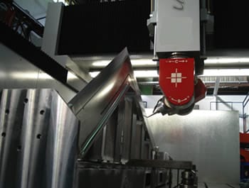 Close-up of a machine tool component in a production machine setup, showcasing advanced precision engineering commonly used by OEMs in the manufacturing industry.